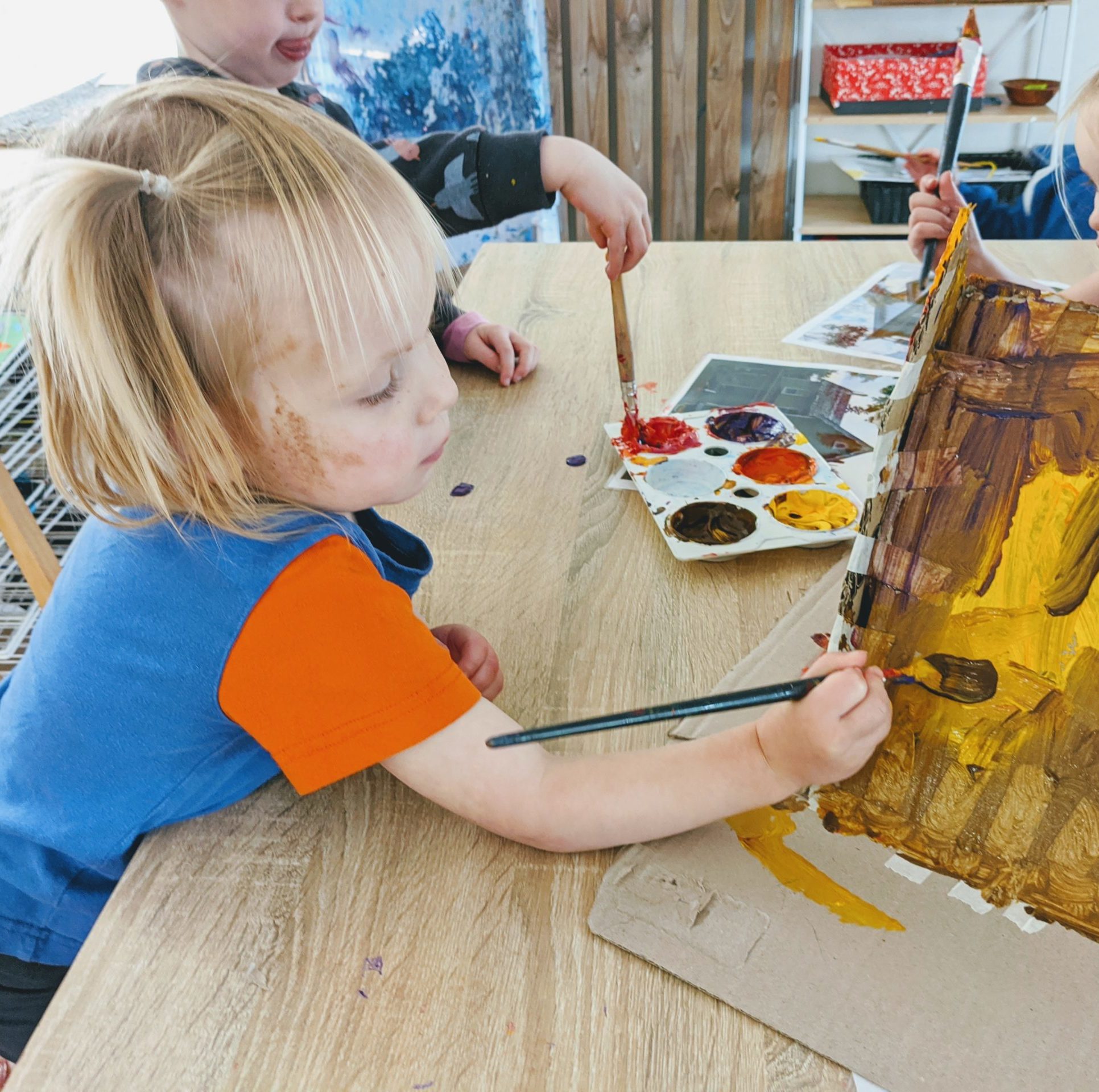 Children Painting building and panting their house