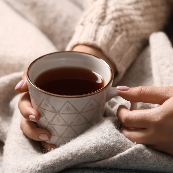 woman holding a cup of tea